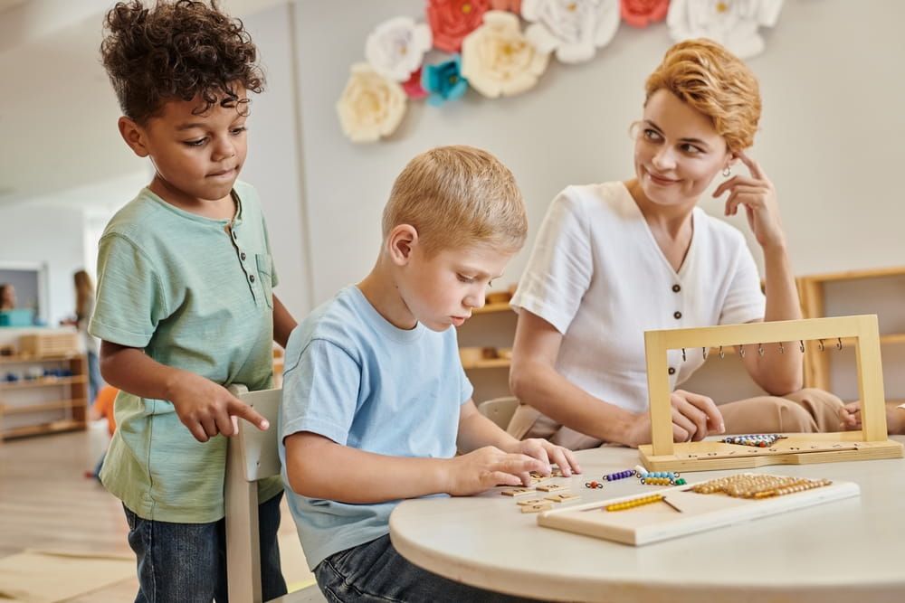 montessori school, happy teacher observing interracial kids, playing educational game, diverse boys