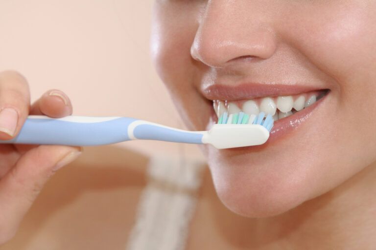 smiling women brush your teeth