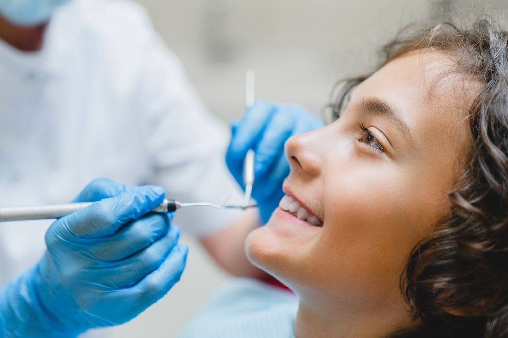Perfect ideal dreamy smile. Preteen caucasian boy visiting dentist
