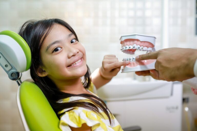 This cute girl is getting ready for her regular dental appointment at the dentist's office