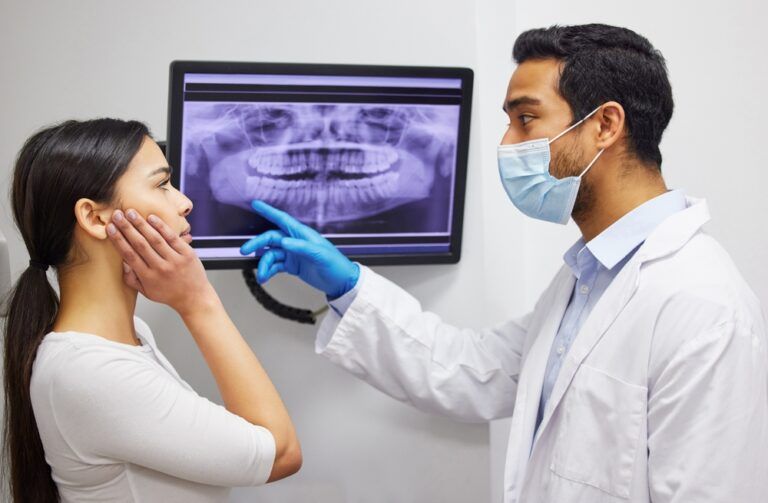 x ray of teeth on screen for patient education, dental diagnosis and treatment planning