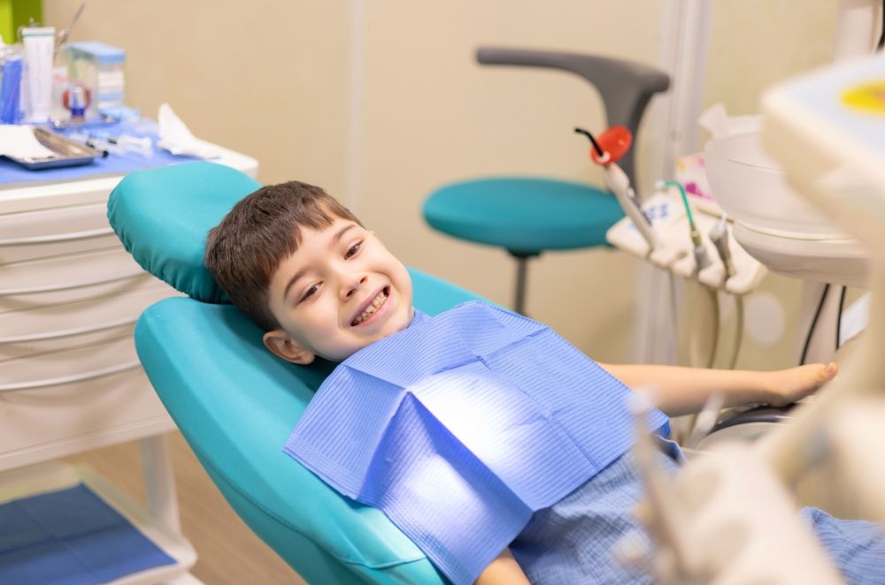 kid in dental office. dentist checking child teeth