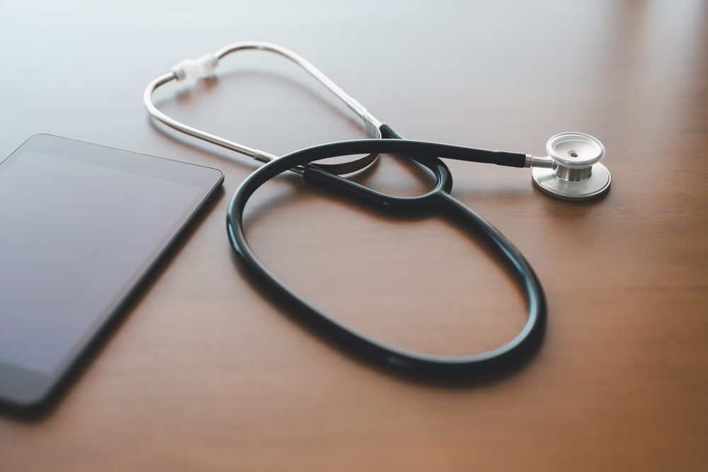 stethoscope on wood table