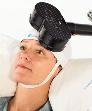 a MagVenture Transcranial Magnetic Stimulation (TMS) therapy device being used