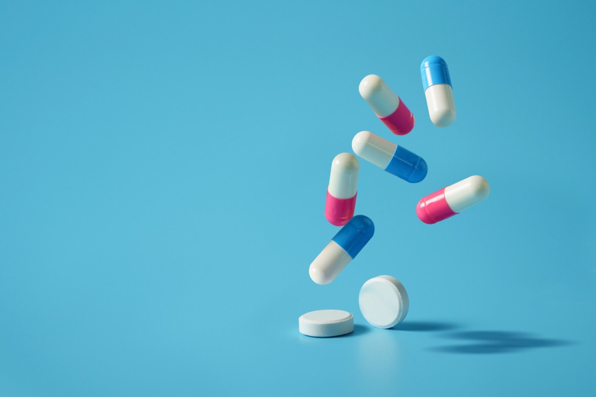 Drug or medicine, medicine pills and antibiotics background Space for text on a blue background