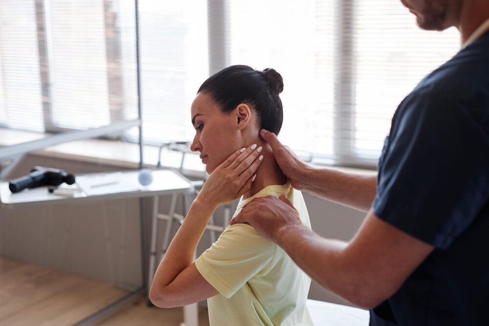 Woman visiting manual therapist in hospital