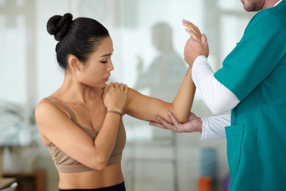 Patient complaining about muscle tension in her arm