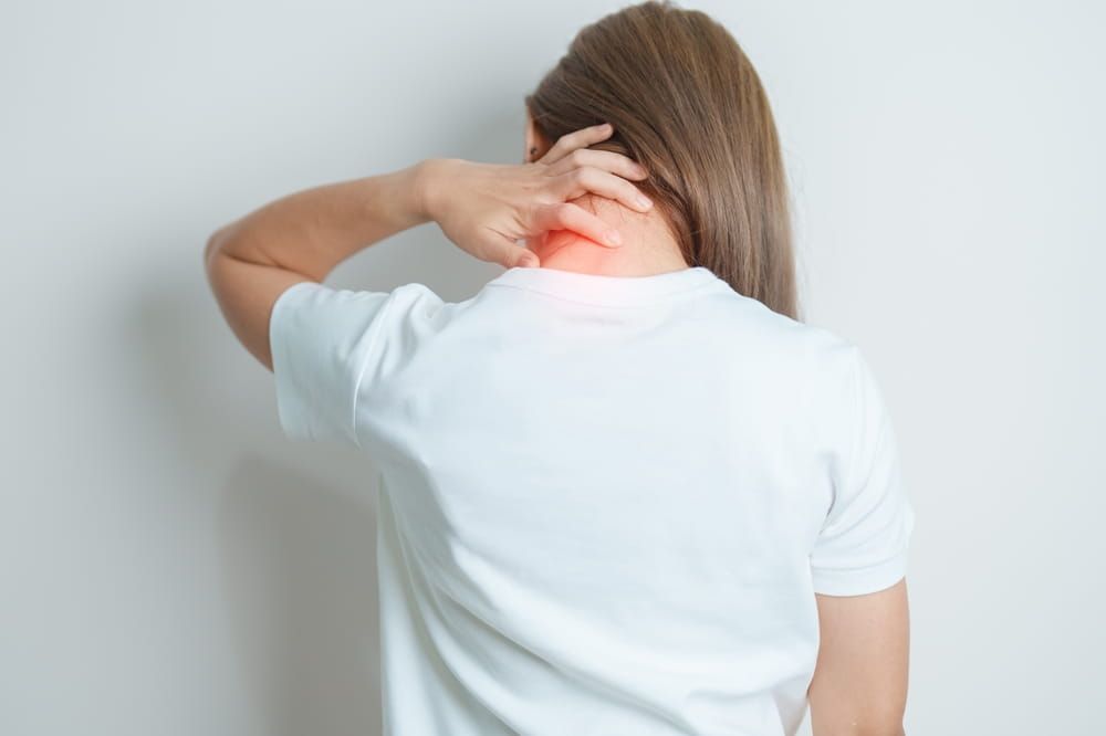 Woman having Neck and Shoulder pain at home