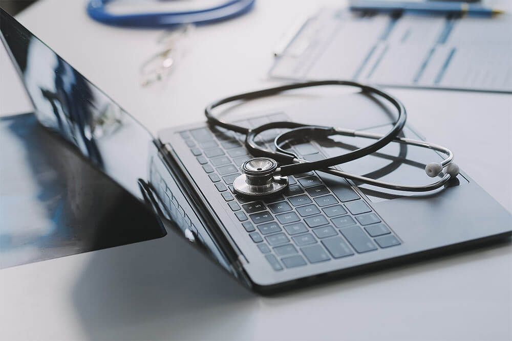 Stethoscope with prescription clipboard and Laptop ,Doctor working an Exam
