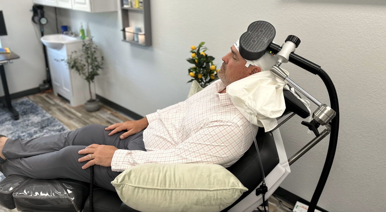 man patient undergoing TMS Therapy