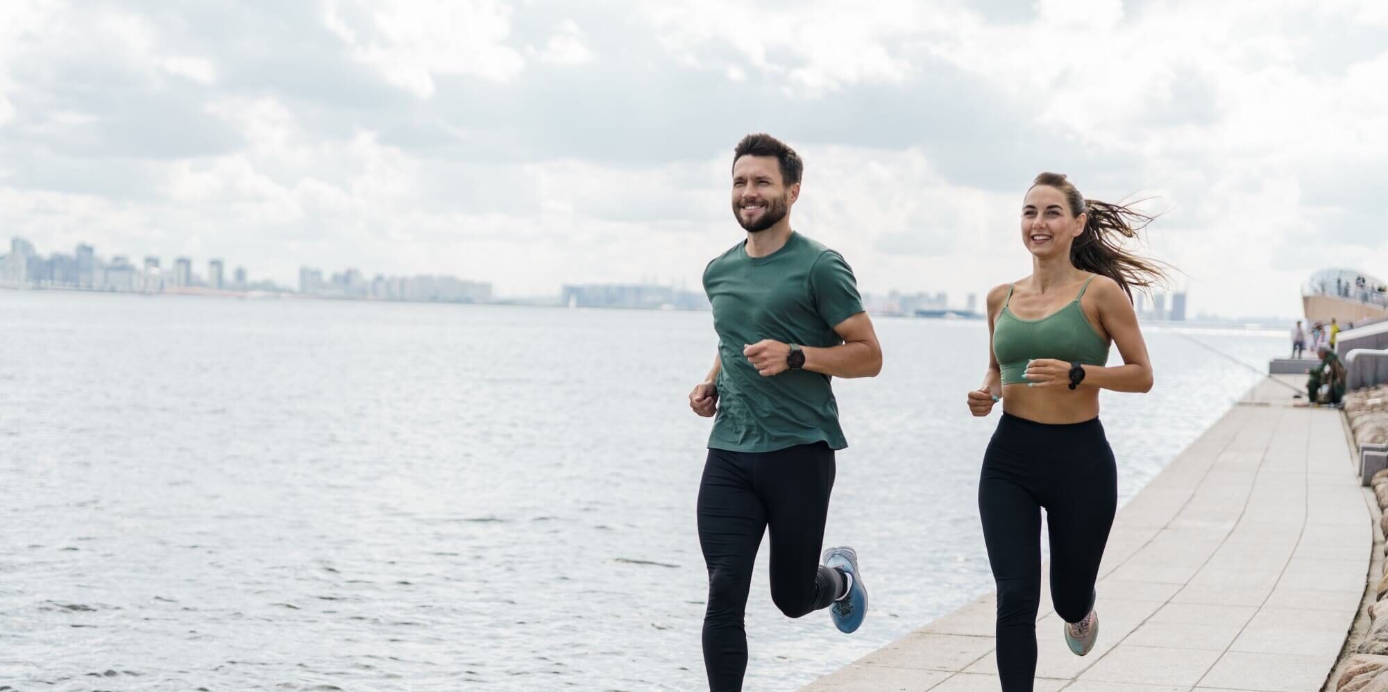 Runners partners training in sports clothes and running shoes