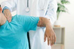 The therapist Stretched a Patient about pain in the muscles of the arms and Shoulders