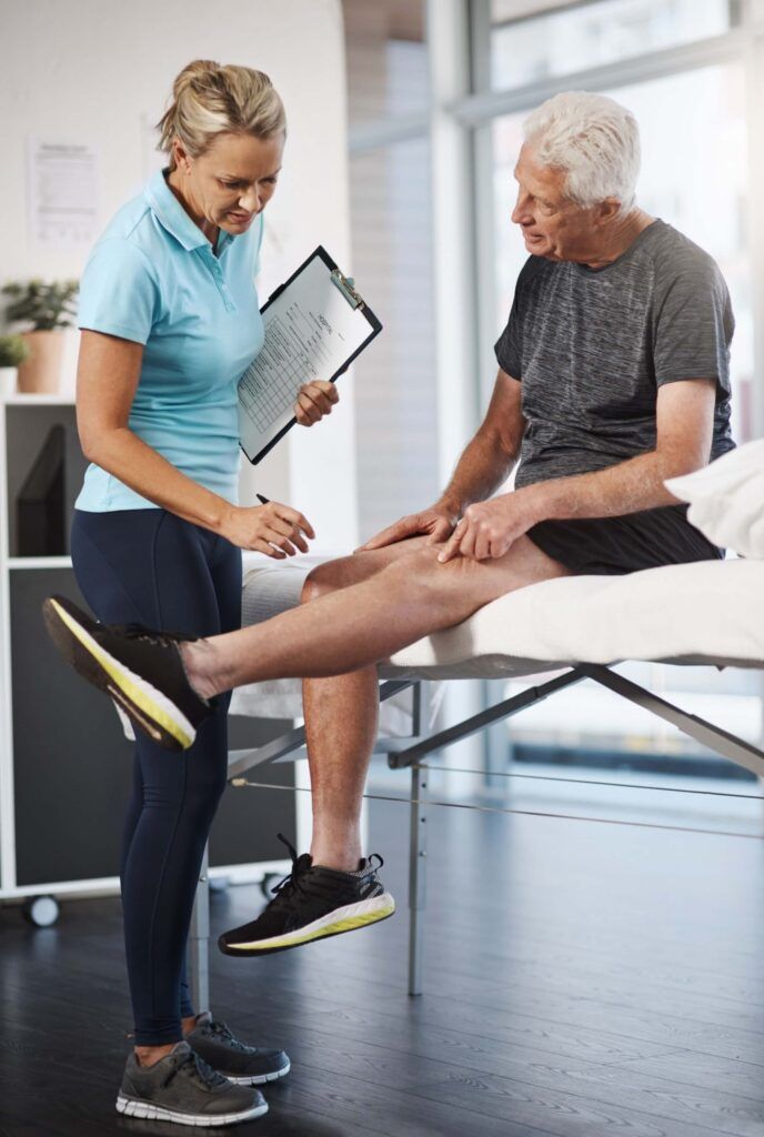 Physical therapy, senior patient and knee injury with medical consultation, exam and assessment of muscle progress