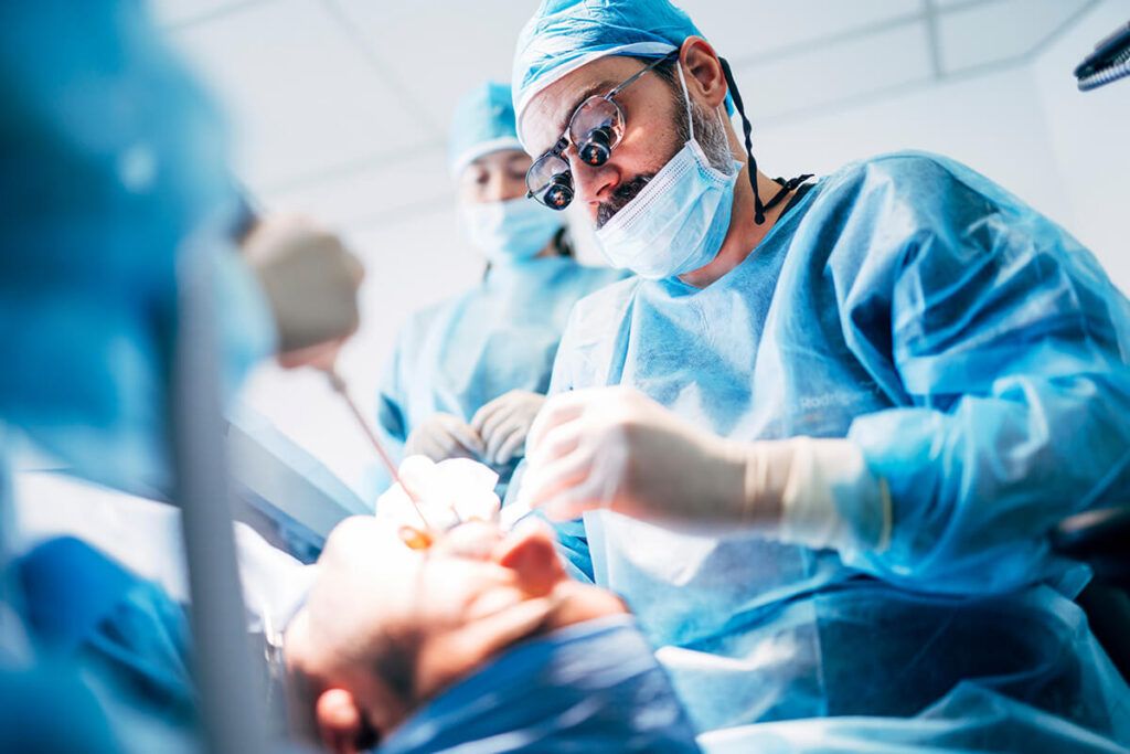 Team dental surgeons working in dental clinic.