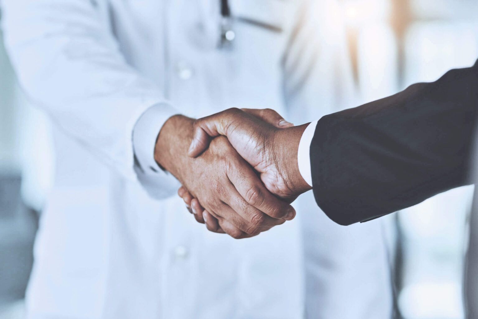 Dentist patient handshake