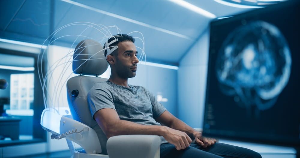 in a High-tech Laboratory Portrait of Male Patient Wearing Headset for Advanced Brain Scanning With Futuristic Neuroimaging Technology