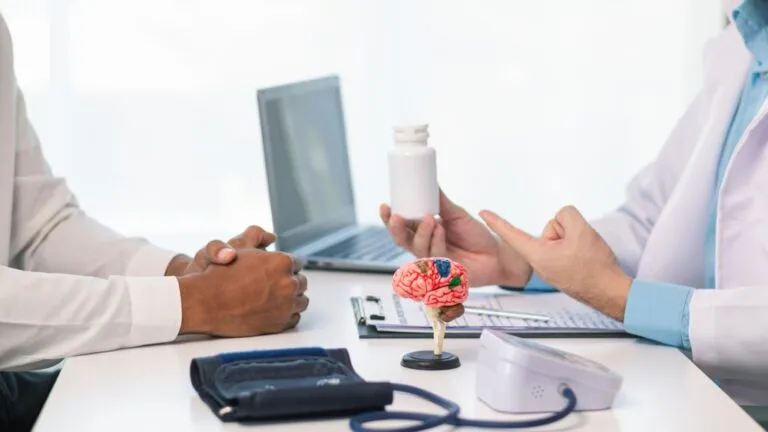 doctor is explaining use of brain tonics after examining patient brain to treat short term memory loss and forgetfulness.