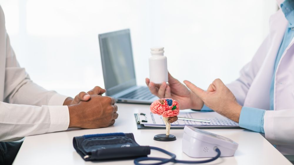 doctor is explaining use of brain tonics after examining patient brain to treat short term memory loss and forgetfulness.