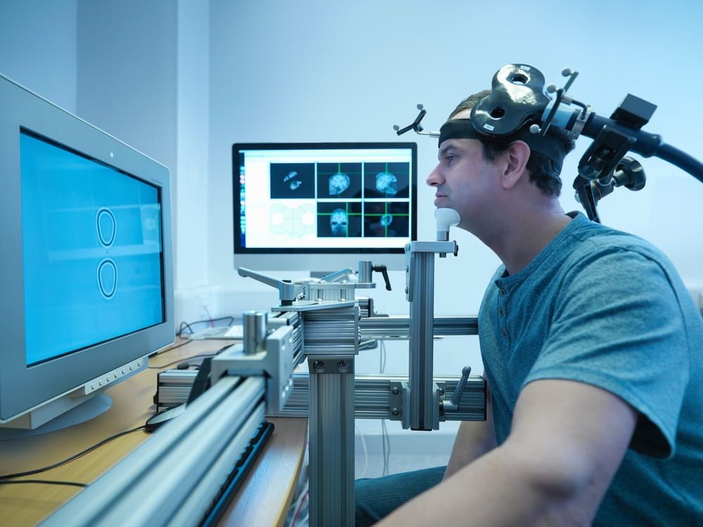 Patient in transcranial magnetic stimulation (TMS) experiment
